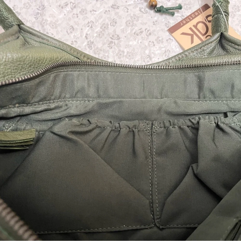 Olive green leather shoulder bag by The Sak